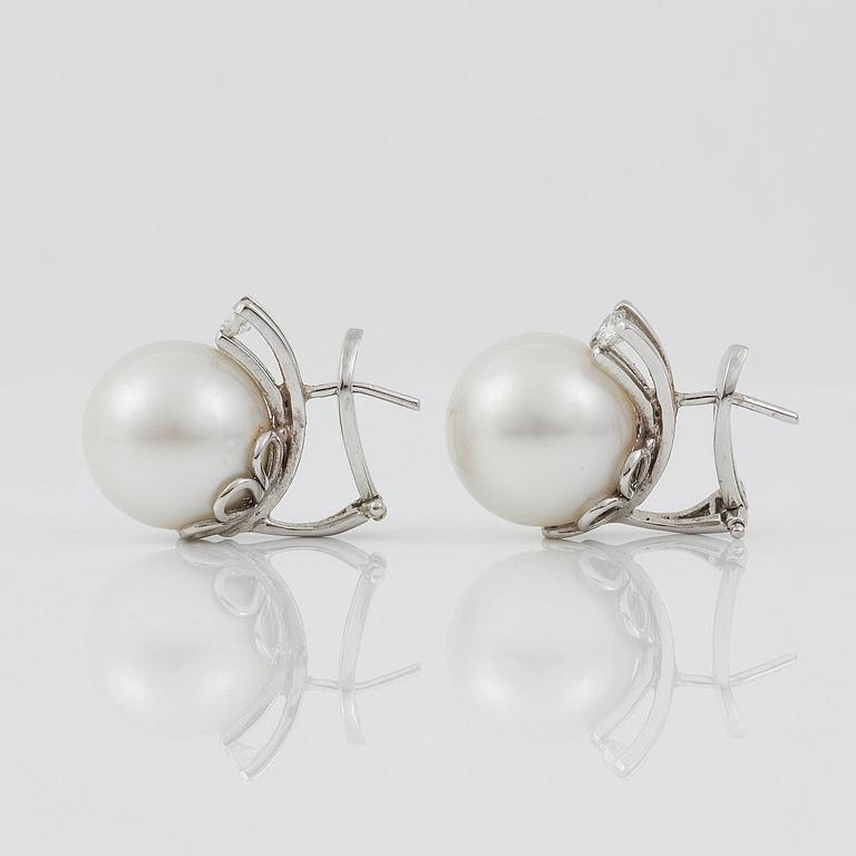 A pair of cultured South sea pearl and diamond earrings. Total carat weight of diamonds circa 0.35 ct.