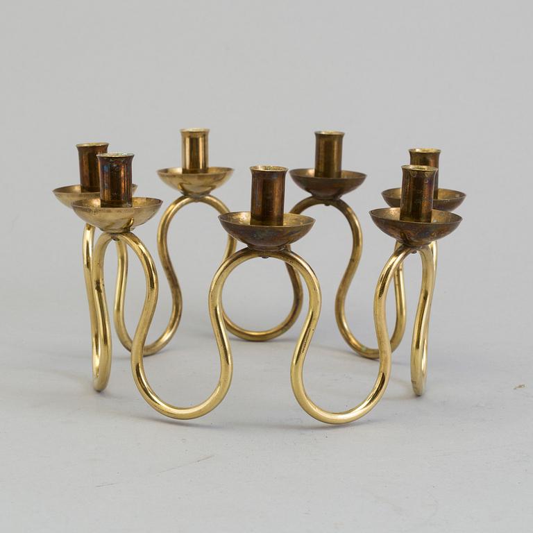 A brass candlestick designed by Lars Holmström for Firma Svenskt Tenn, second half of the 20th century.
