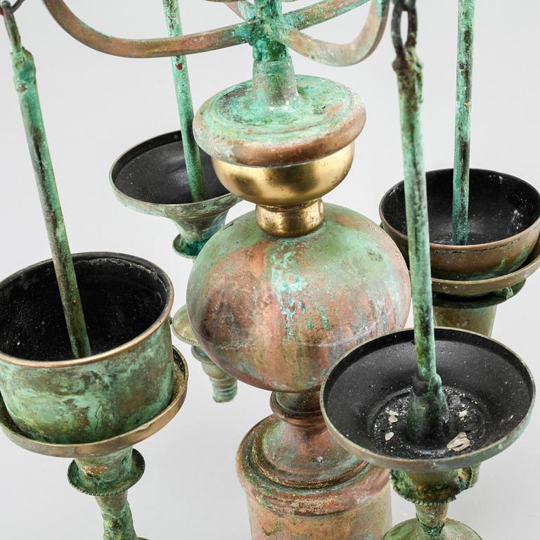 a metal sculpture/candelabra, signed and dated 2006.