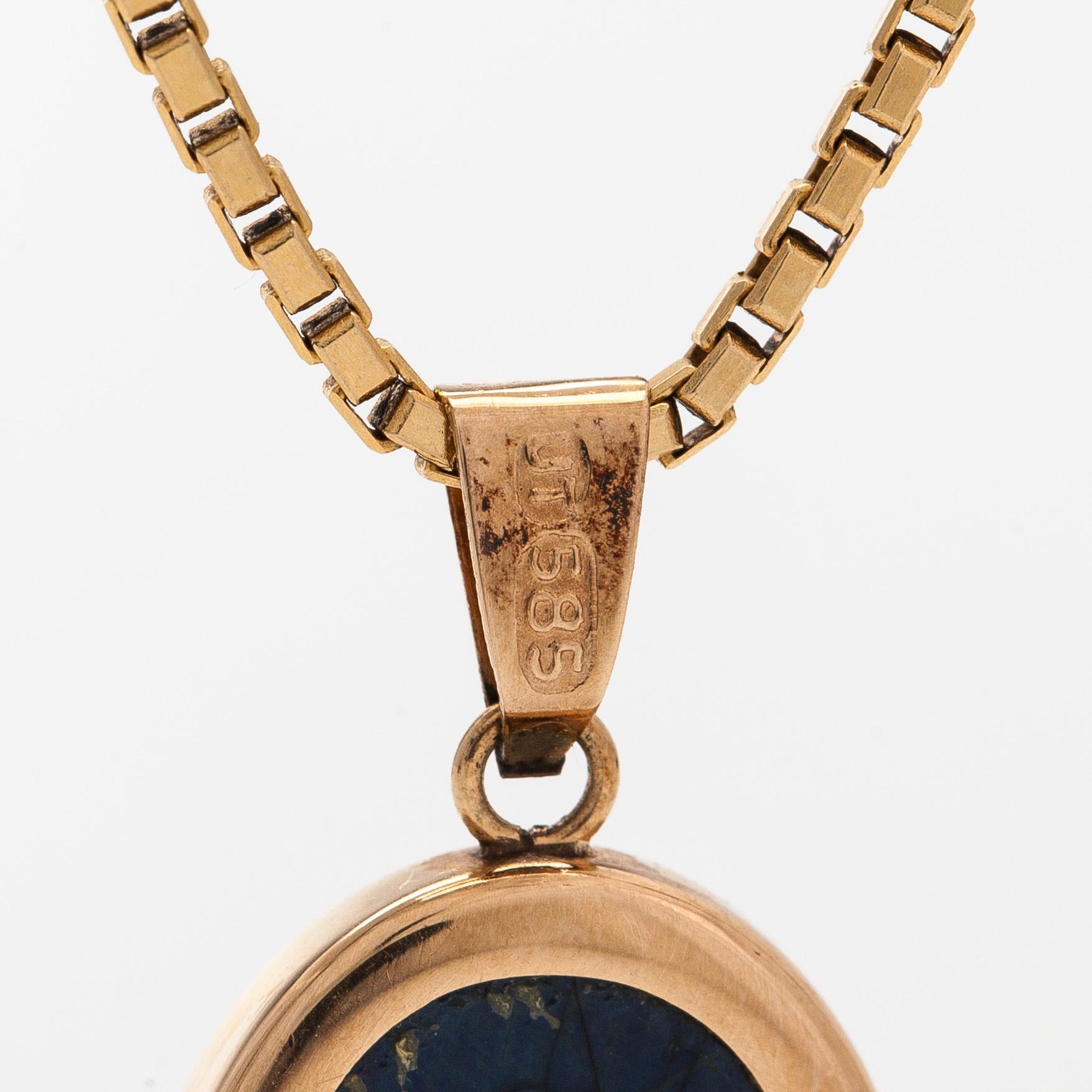 A 14K gold necklace with a spectrolite pendant. Finnsih control marks.