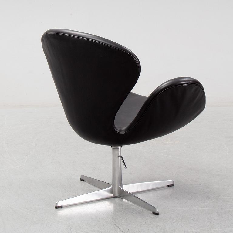 Arne Jacobsen, a black leather 'Swan' chair, Fritz Hansen, Denmark, 1967.