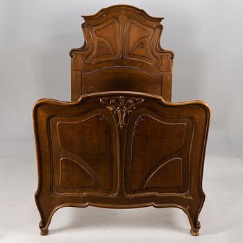 A pair of early 20th Century art nouveau style beds.