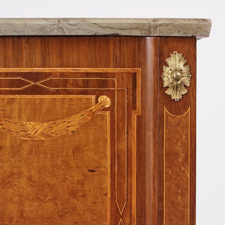 A Gustavian marquetry, ormolu-mounted and limestone-top commode by Georg Haupt (master in Stockholm 1770-84).