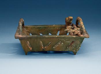 1396. A green glazed vessel, Han dynasty (206 BC – 220 AD).