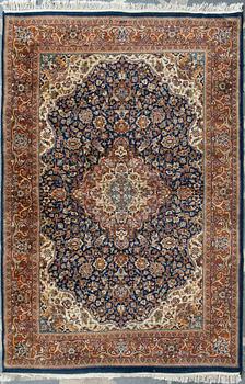 An oriental carpet. Circa 203x137 cm.