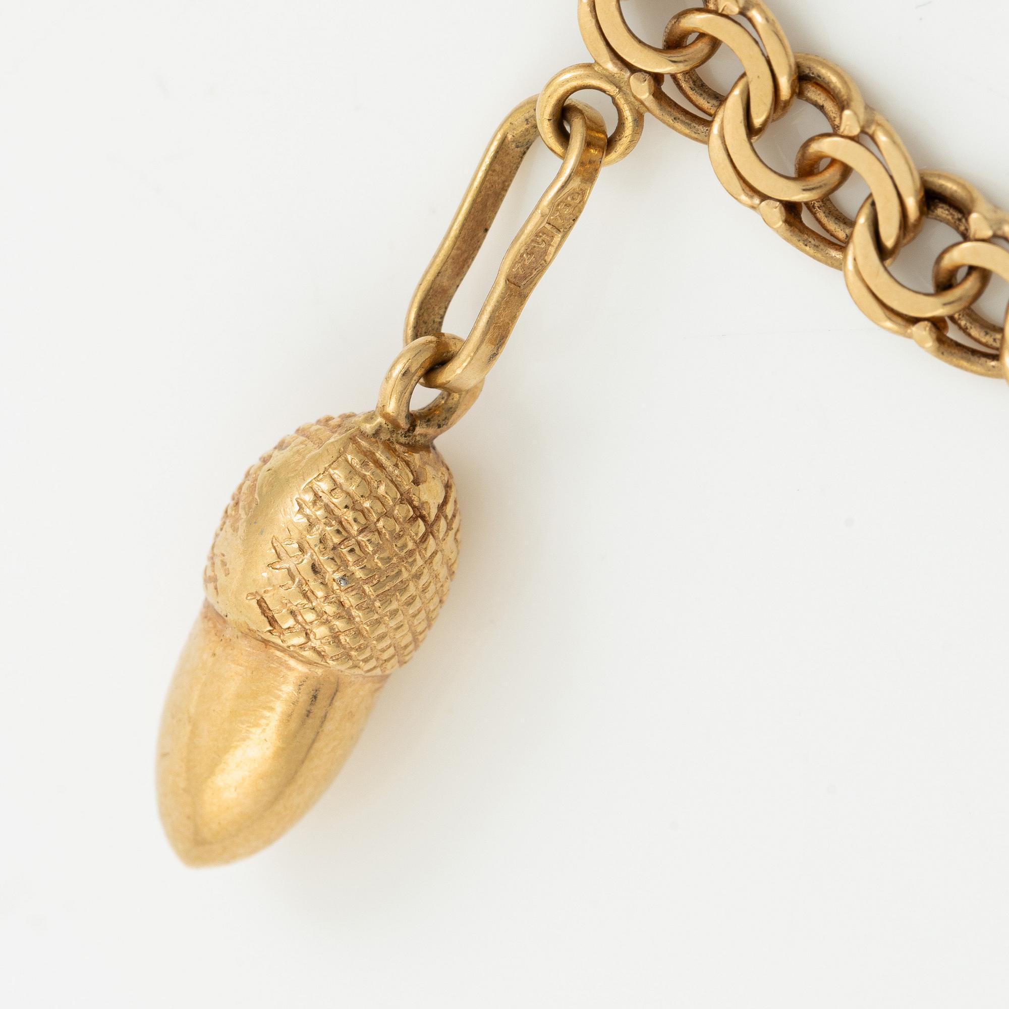Bracelet, 18K gold with charms.