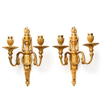 109. A pair of Louis XVI late 18th century gilded bronze two-light wall-lights.