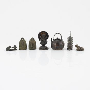 A group of bronze and metal miniatures, seven pieces, some Japanese, Meiji period (1868-1912).