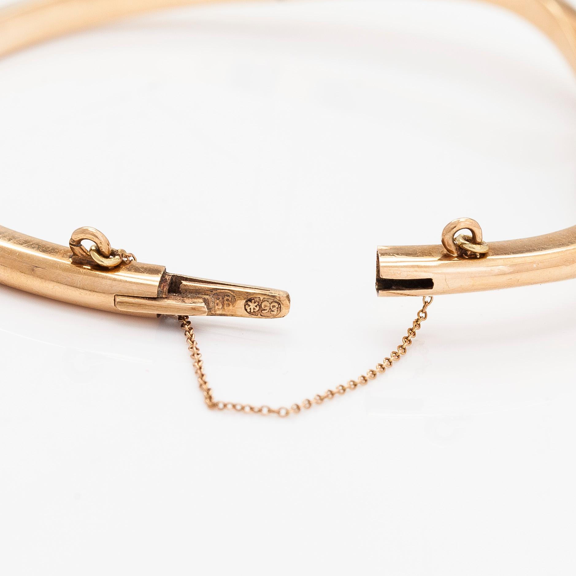 A 14K gold bangle, set with old-cut diamonds, St. Petersburg 1882-1898.