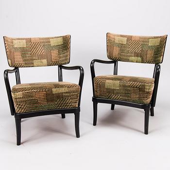 A mid-20th Century pair of armchairs.