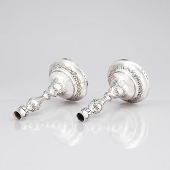 A pair of Swedish 18 century silver candelabras, mark of Lars Åkerblom Gävle 1775, arms by Christian Kullberg.