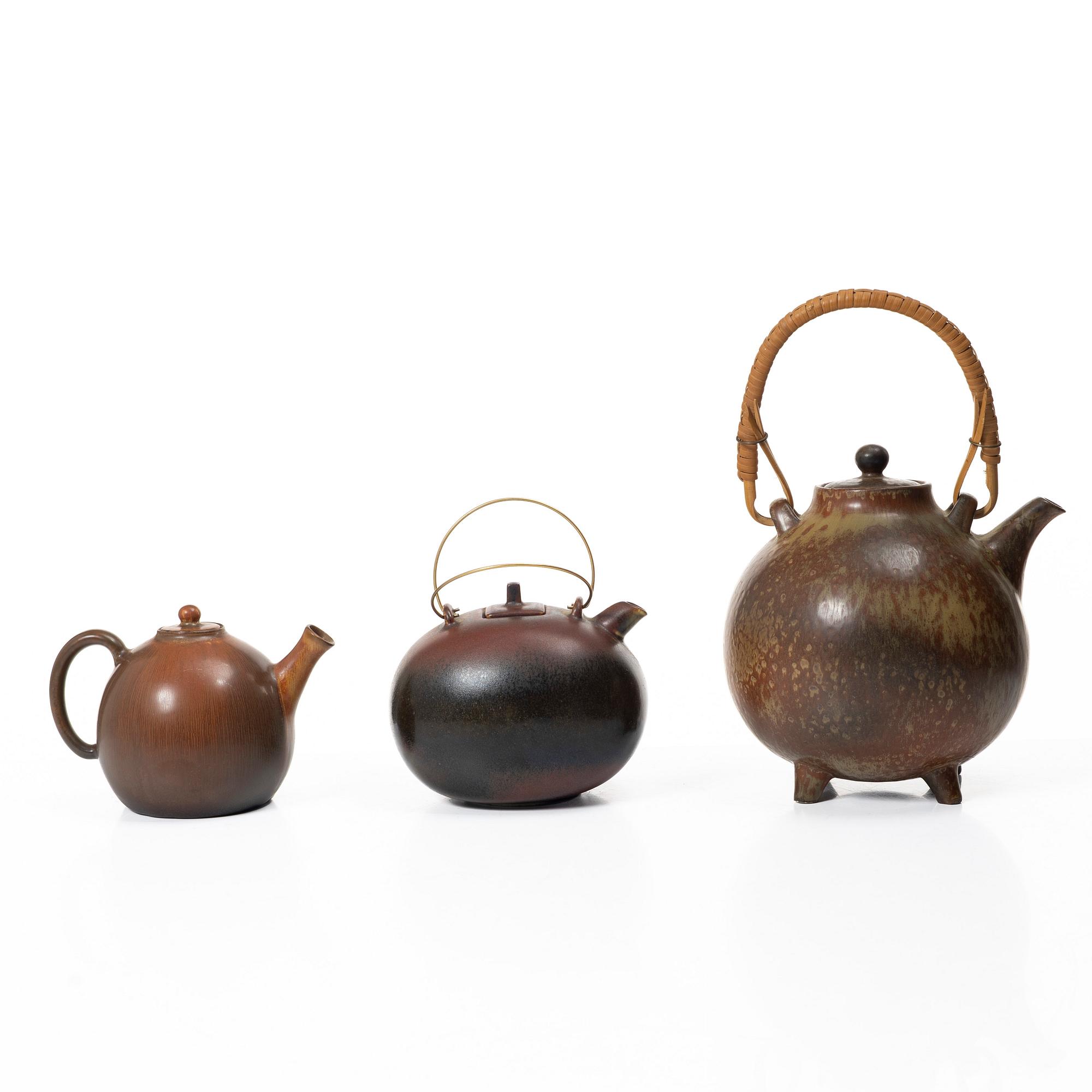 Gösta Grähs, , Gunnar Nylund and Carl-Harry Stålhane, three stoneware teapots, Rörstrand.