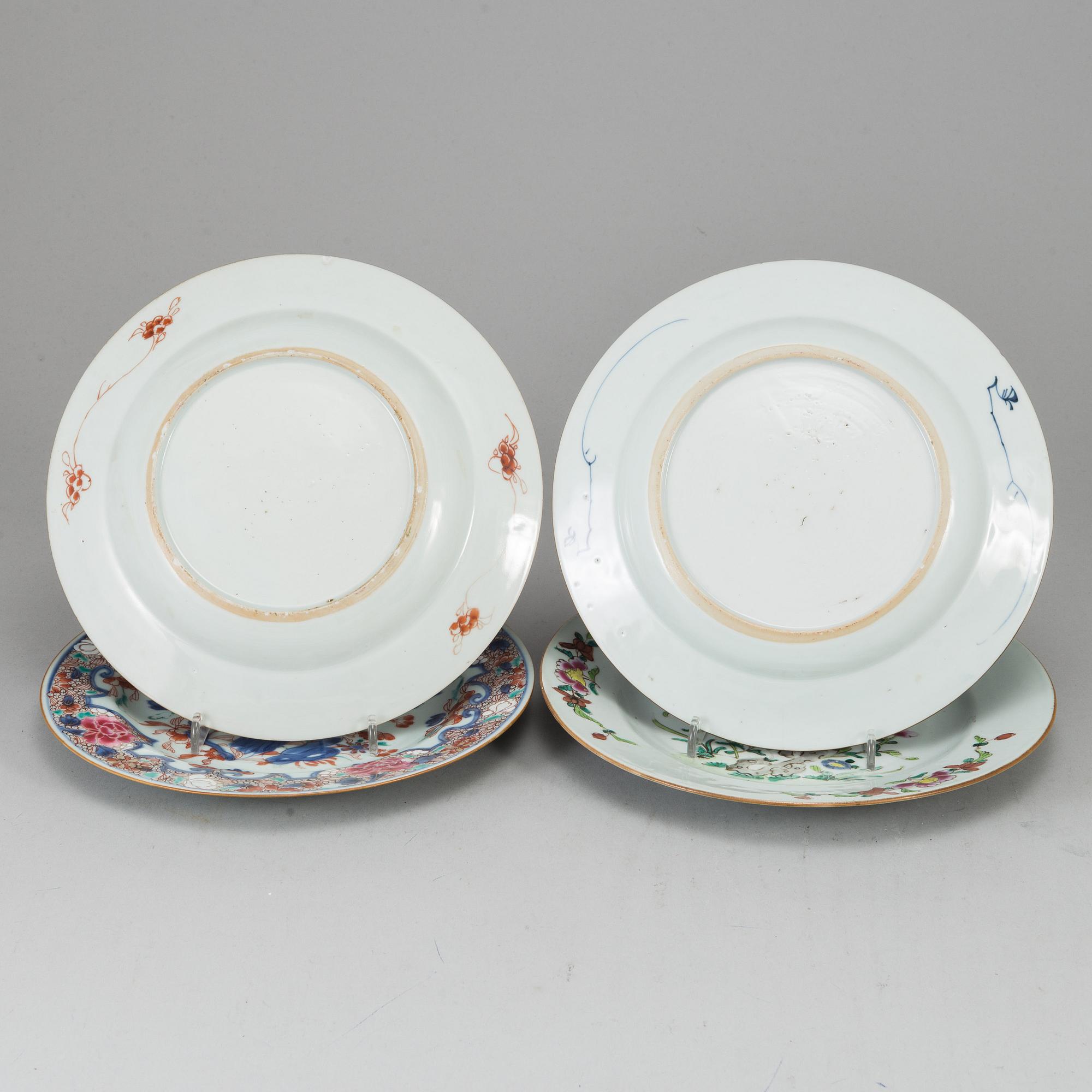 A group of four famille rose and blue and white plates, Qing dynasty, Qianlong (1736-95).
