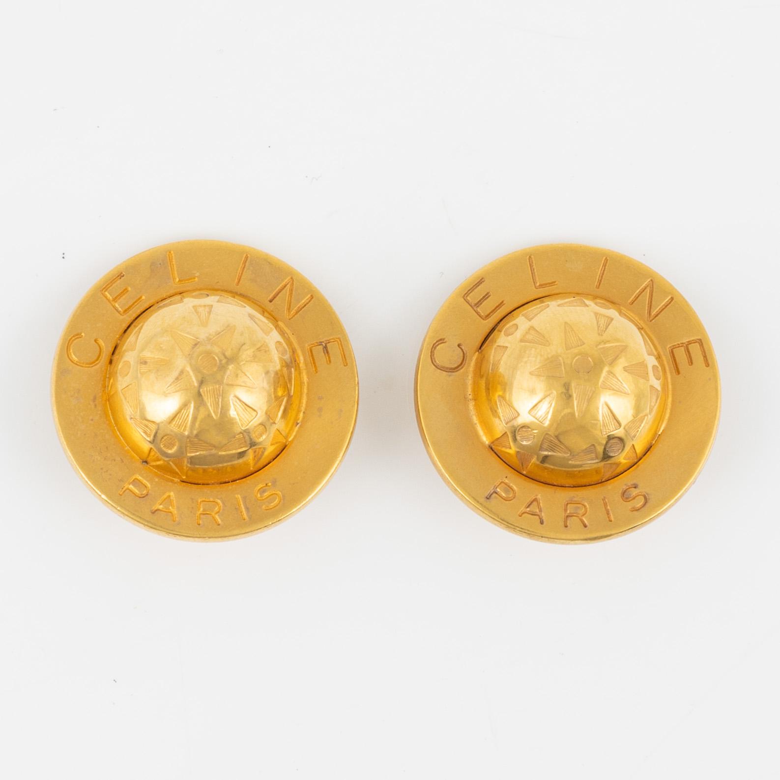 Céline, a pair of clip on earrings.