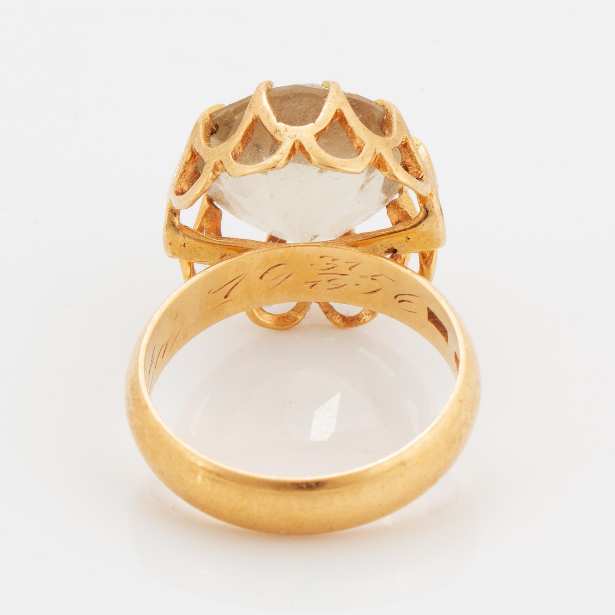 Ring, 18K guld med rund fasettslipad citrin.