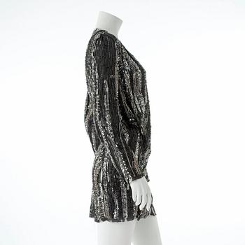 BALMAIN, a black and silver sequin dress.