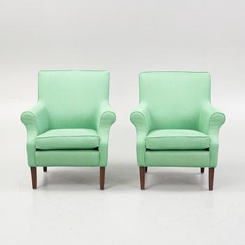 Marie Norell-Möller, a pair of "Leo" armchairs Norell Möbler, Sweden, and a foot stool.