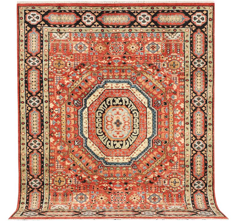 A Mamluk design carpet, c. 304 x 235 cm.