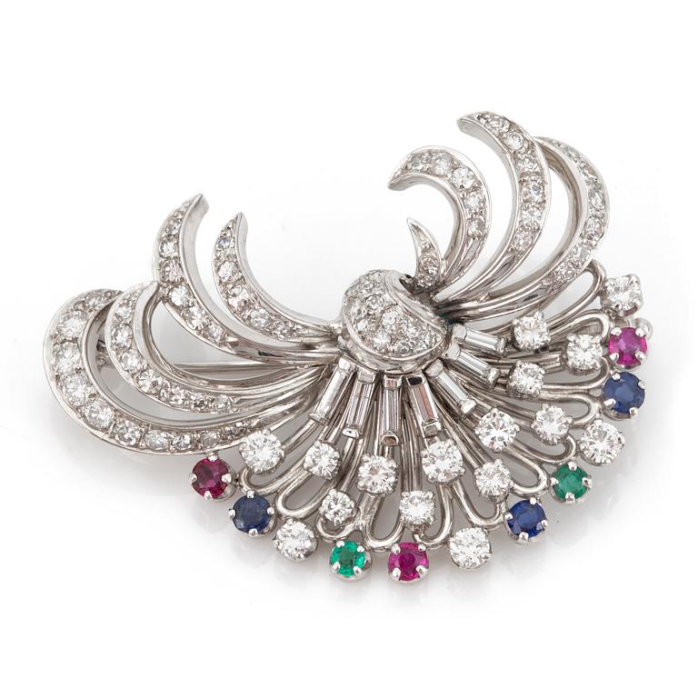 A brooch set with rubies, sapphires, emeralds and diamonds.