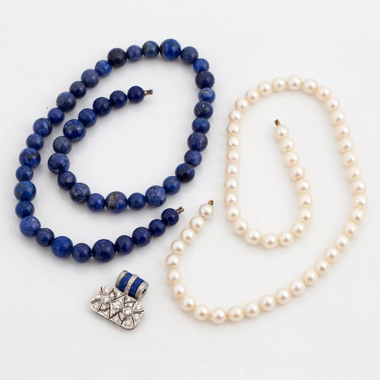 A Gaudy clasp and two necklaces.