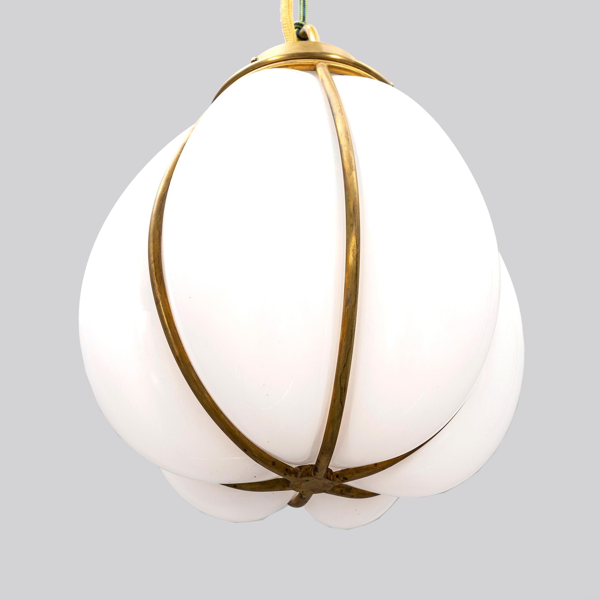 A contemporary 'Hobo' brass and glass pendant lamp by Gustaf Nordenskiöld for Örsjö.