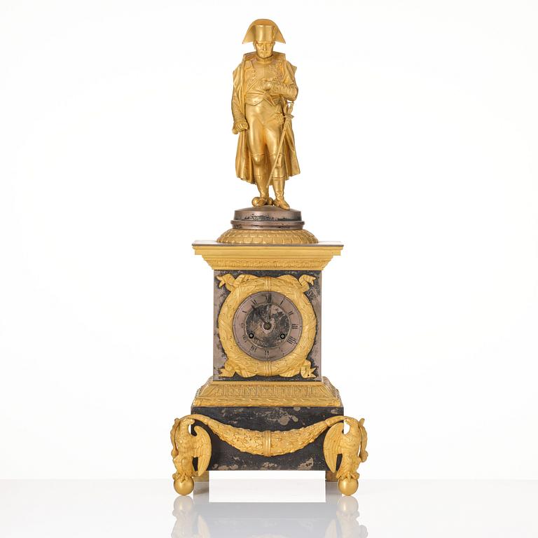 A French Empire ormolu and silvered bronze figural mantel clock, first part of the 19th century.