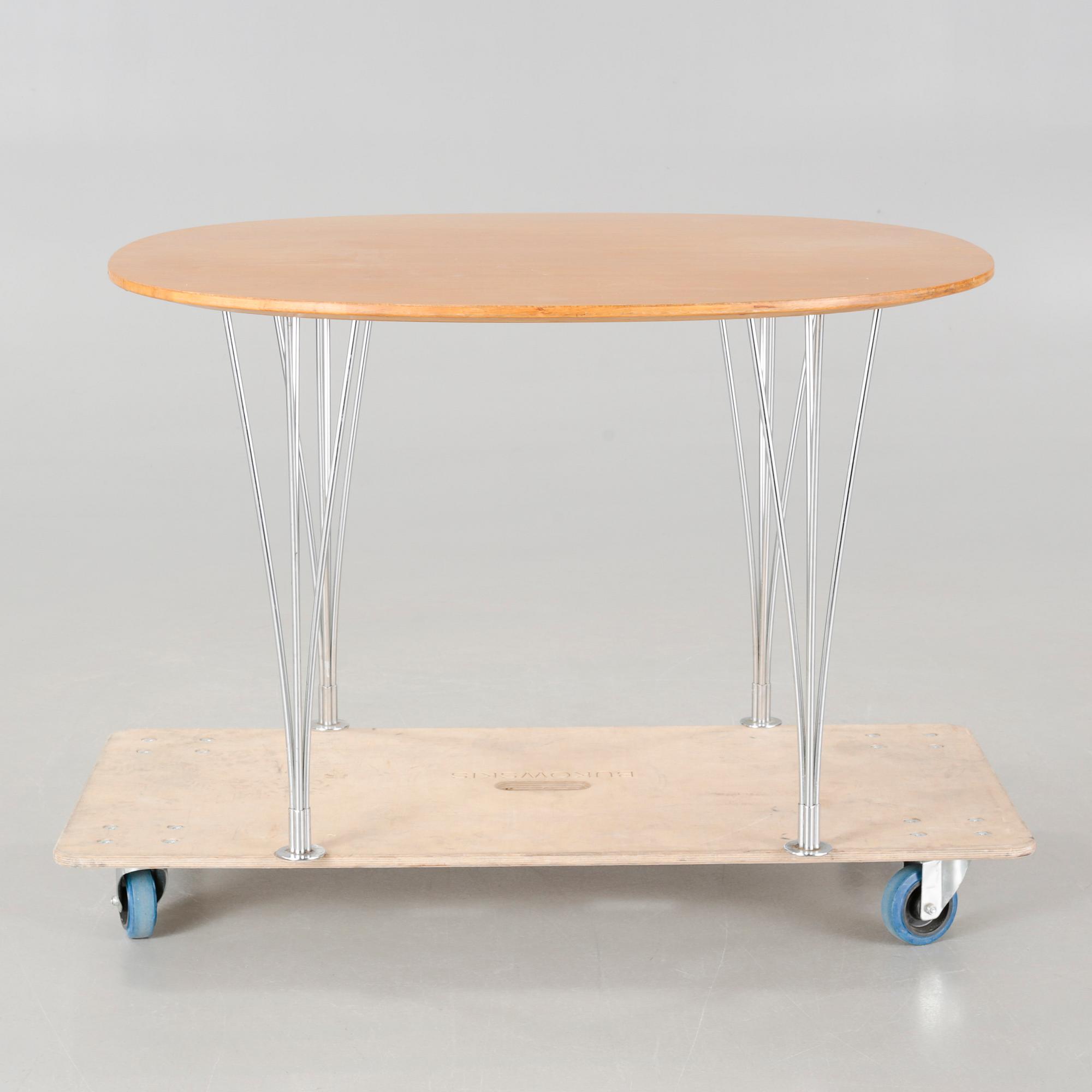 A  table by Bruno Mathsson and Piet Hein,  Mathsson International on license för Fritz Hansen.