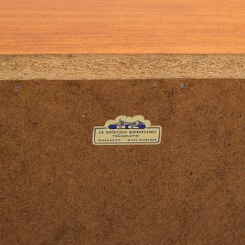 A 1950s teak veneer chest of drawers.