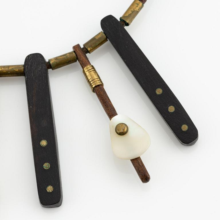 Vivianna Torun Bülow-Hübe, a necklace, wood, leather, mother-of-pearl and brass, most likely 1950's.