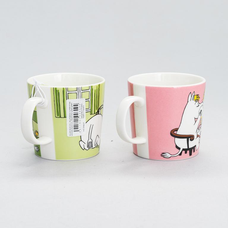 Eight Moomin Characters mugs in vitro porcelain, Arabia, Finland.