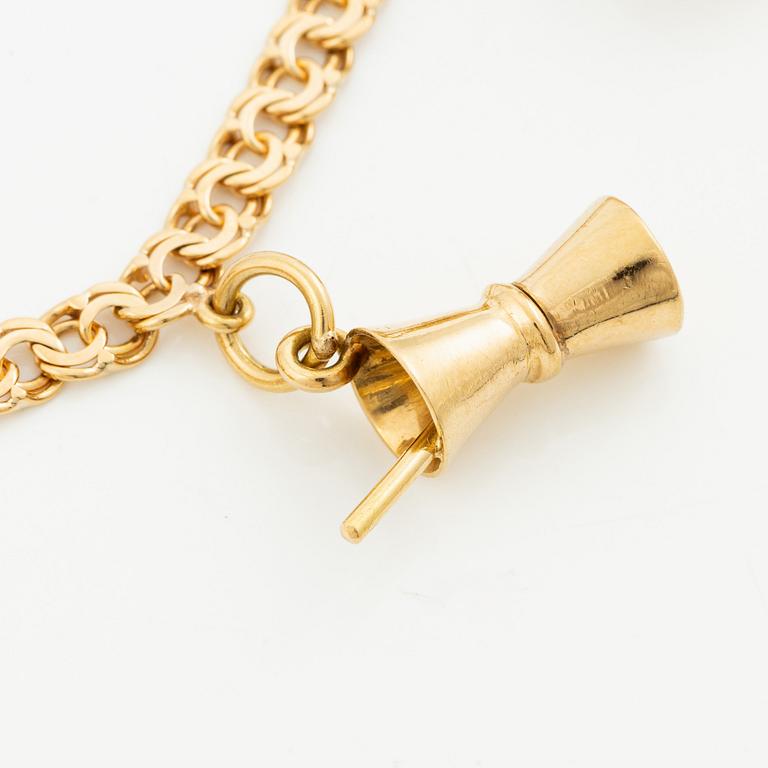 Bracelet, 18K gold bismarck link. With charms.