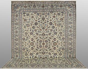 A Keshan carpet, signed, approx. 398 x 301 cm.