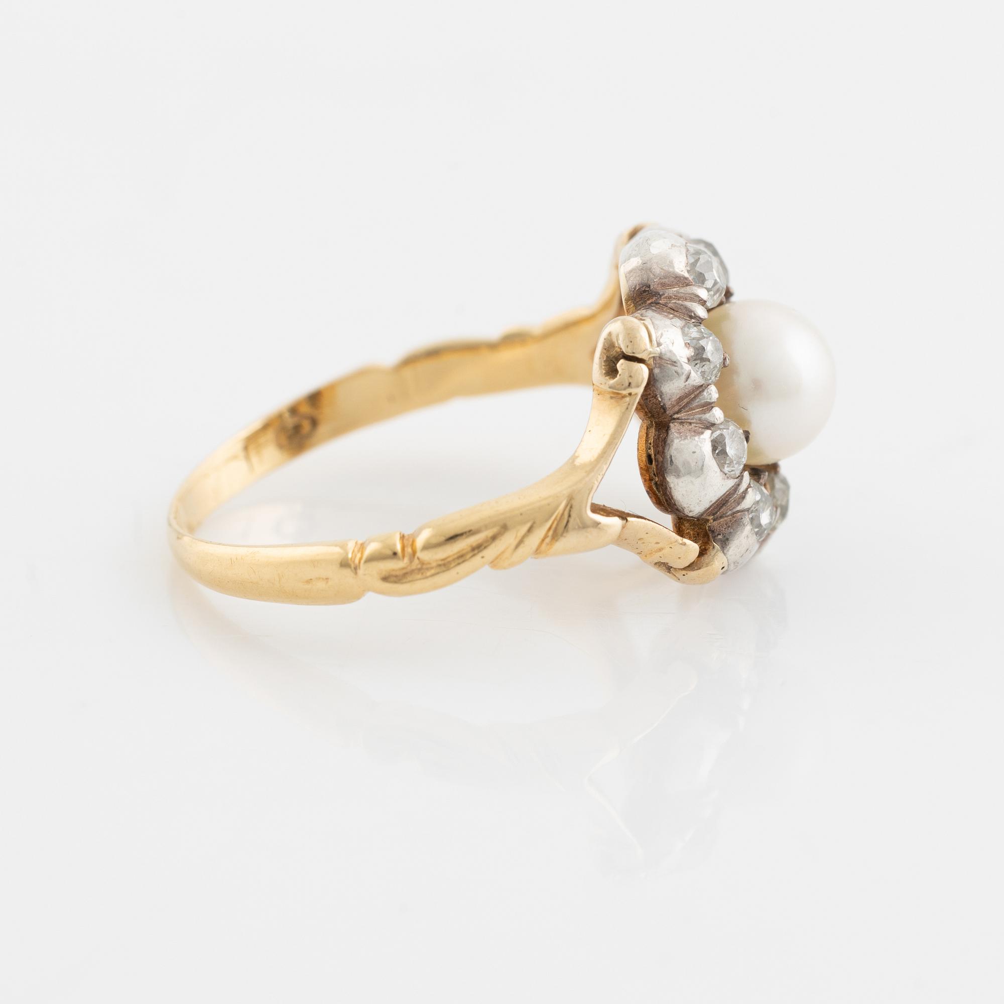 An 18K gold ring and silver set with a pearl and old-cut diamonds.