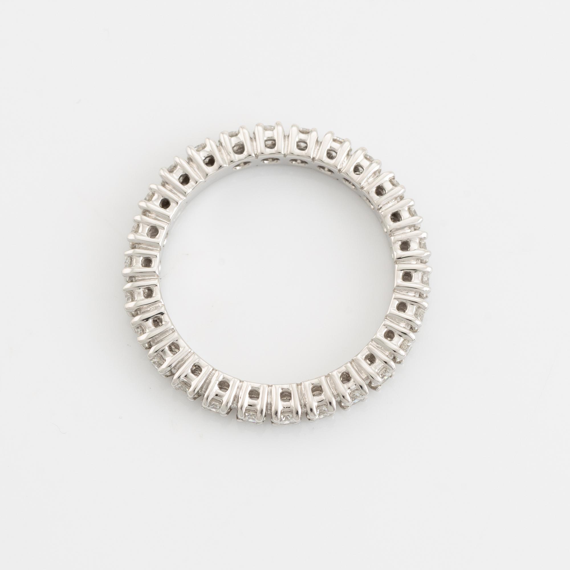 Brilliant cut diamond eternity ring.