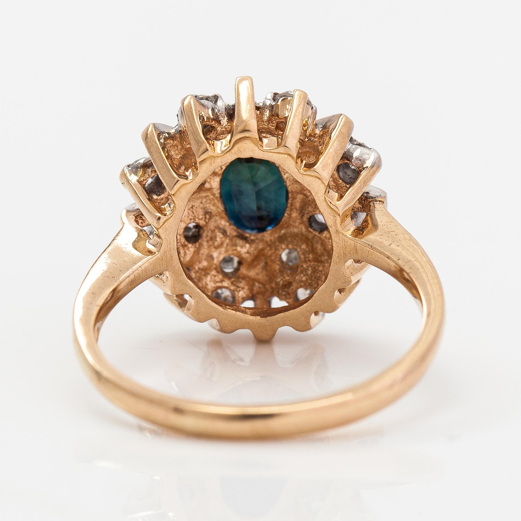 A 14K gold ring with diamonds ca. 0.40 ct in total and a sapphire. Finland 1995.