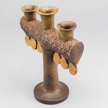 LISA LARSON, a ceramic candelabra.