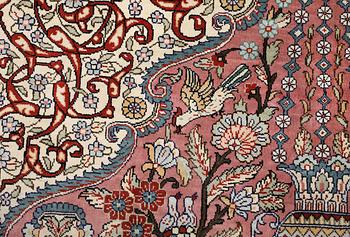 An oriental silk rug, approx. 155 x 93 cm.