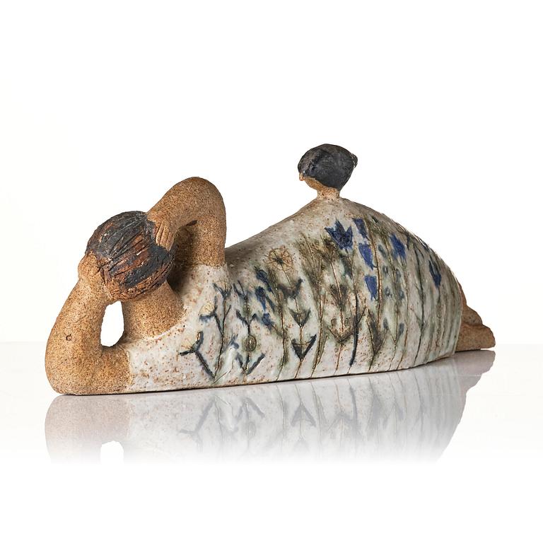 Lisa Larson, a unique chamotte stoneware sculpture of a reclining female figure with a bird, Gustavsberg Studio, probably 1950s-60s.