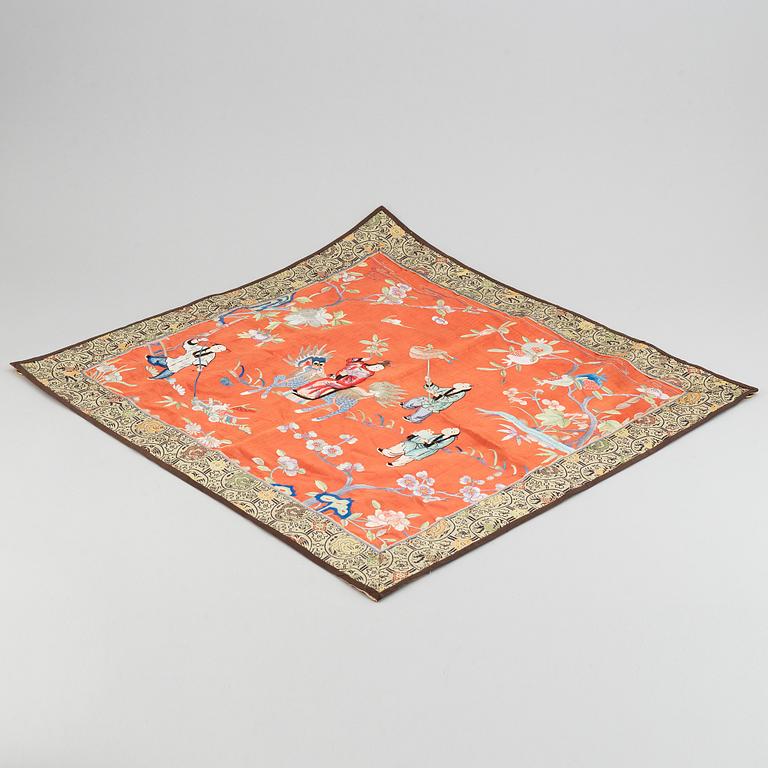 A Chinese silk embroidery, early 20th Century, a chinese blue and white placque, Ming dynasty (1368-1644).