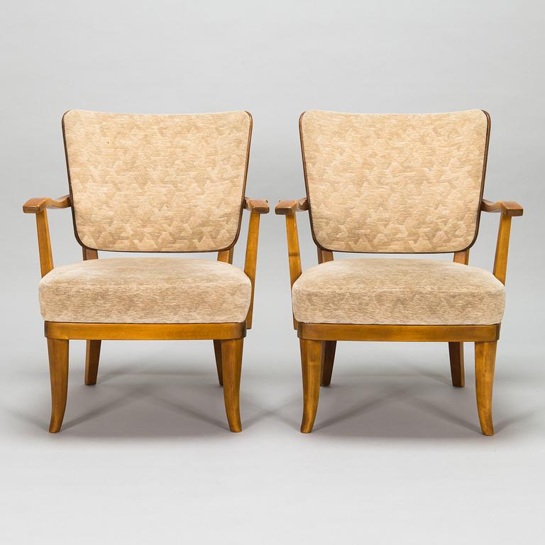 Einari Kyöstilä, a pair of 1940s open armchairs for Oy Stockmann Ab, Keravan Puusepäntehdas, Finland.
