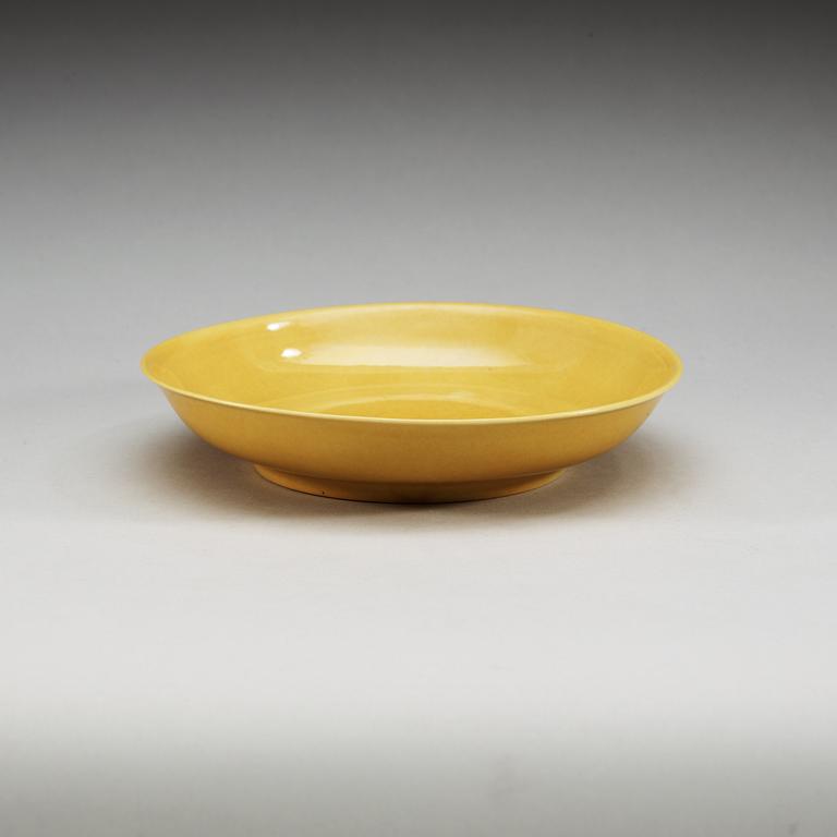 A yellow glazed dish, Ming dynasty, with Zhengdes six character mark and of the period (1506-21).