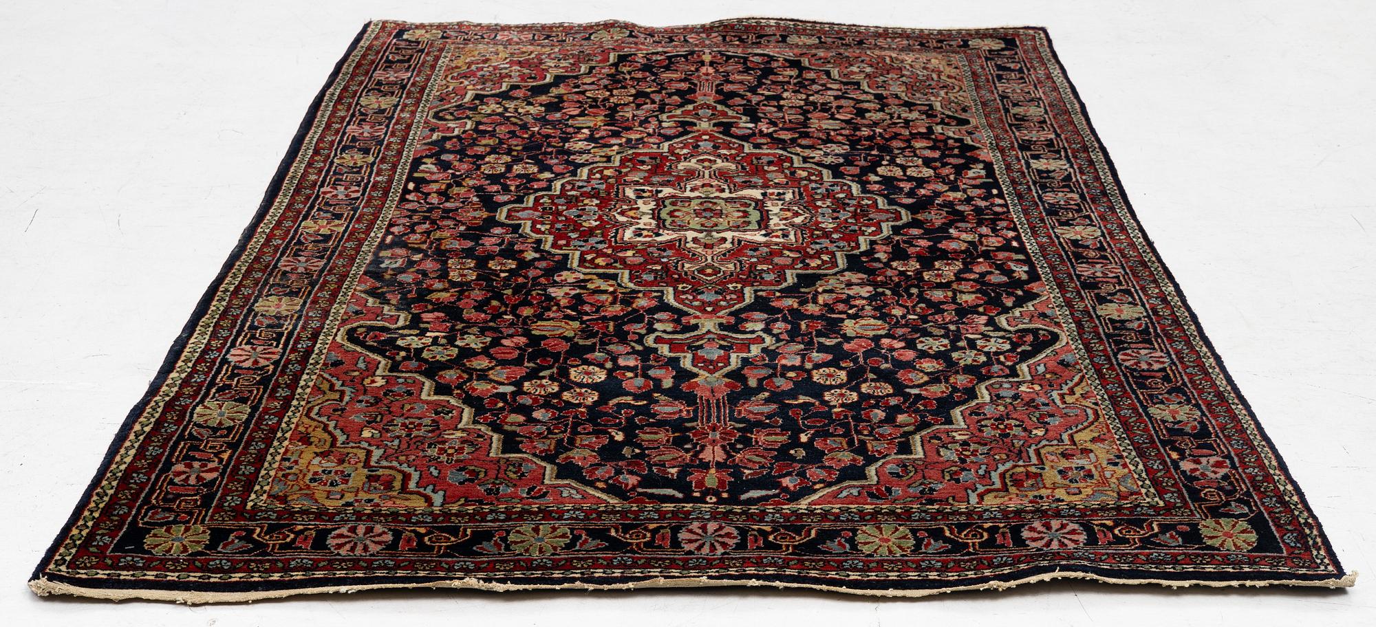 A semi-antique Sarouk rug, west Persia, c. 205 x 131 cm.