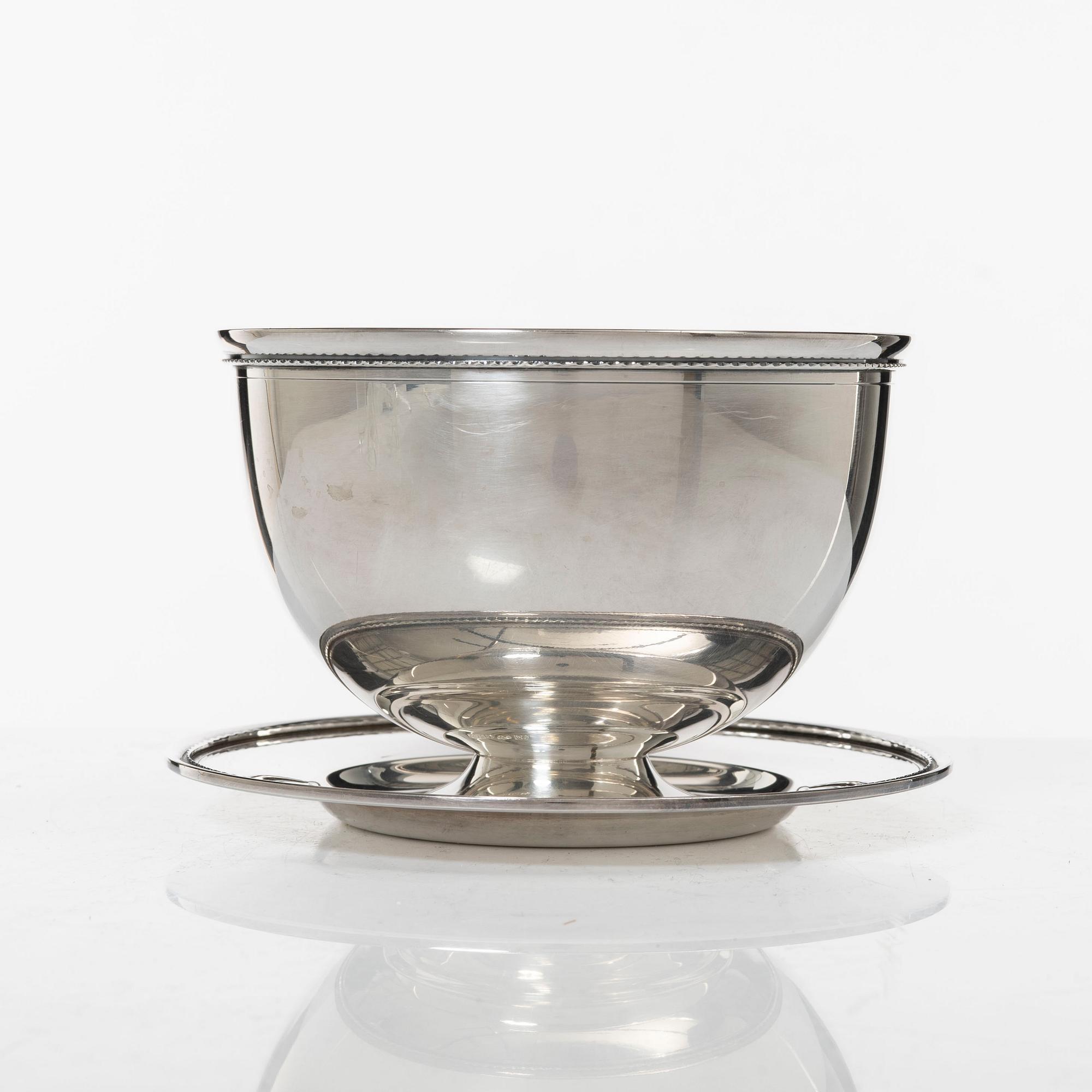 A Swedish silver Sweetmeat/sauce bowl on a plate, mark of company Guldsmedsaktiebolaget, Stockholm 1962.