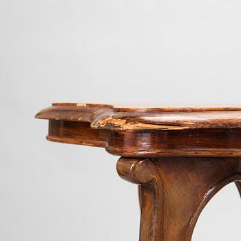 A pair of Russian armchairs and a table, late 19th century.