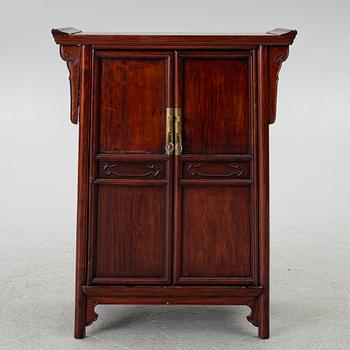 A small Chinese wooden cabinet, 1900s.