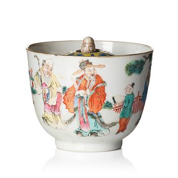 A famille rose 'trick cup' with a little figure, Qing dynasty, 19th Century.