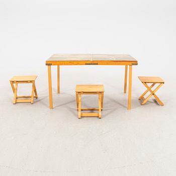 A portable picknick table and stools mid 1900s.