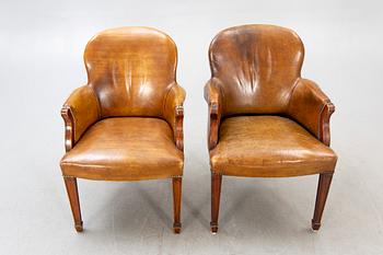 Fritz Henningsen, a pair of mahogany and leather armchairs Denmark mid 1900s.