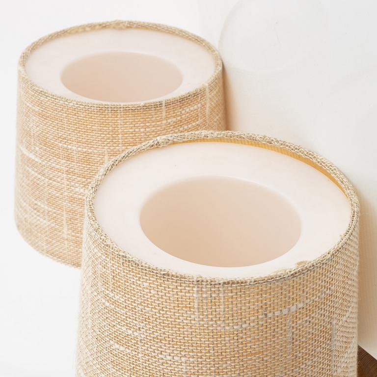 Uno & Östen Kristansson, a pair of pine wall lamps, Luxus, 1970s.