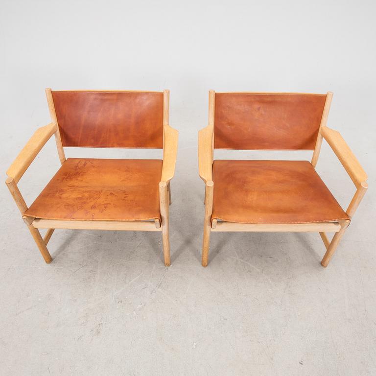 Alf Svensson, a pair of oak and leather armchairs from the second half of the 20th century.